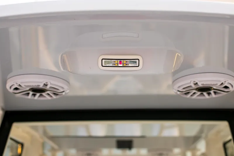 New Stock Yacht Photos Pics 2026 Yellowfin 36 Offshore boat interior with speakers and LED light.