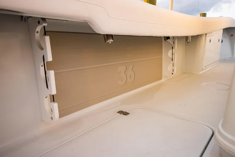 New Stock Yacht Photos Pics 2026 Yellowfin 36 Offshore boat interior detail, showcasing storage compartment and deck design.