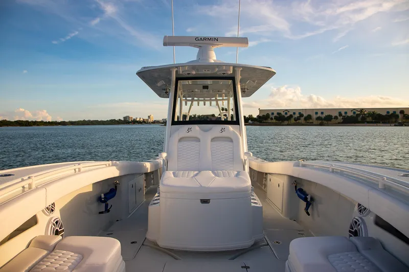 New Stock Yacht Photos Pics 2026 Yellowfin 36 Offshore boat interior on calm water at sunset.