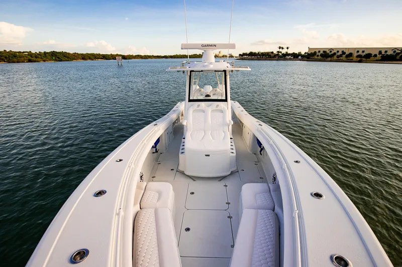 New Stock Yacht Photos Pics 2026 Yellowfin 36 Offshore boat on calm water, showcasing spacious deck and seating.