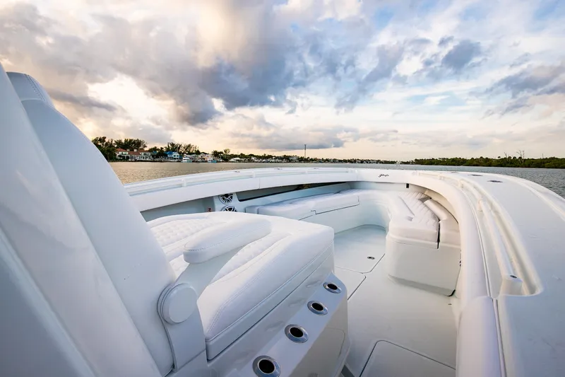 New Stock Yacht Photos Pics 2026 Yellowfin 36 Offshore boat interior with white seating and scenic water view.