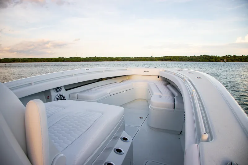 New Stock Yacht Photos Pics 2026 Yellowfin 36 Offshore boat interior with luxurious seating on calm water.