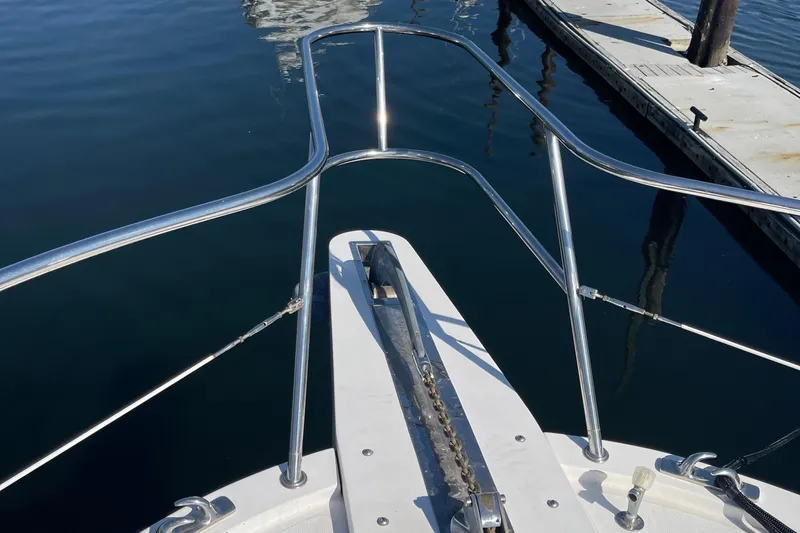  Yacht Photos Pics Bow view of 1997 McKinna 48 Pilothouse yacht at dock.