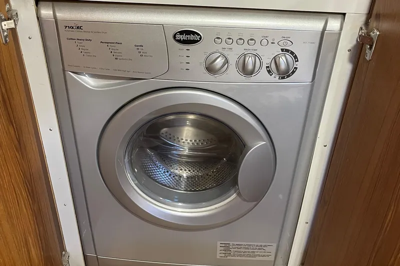  Yacht Photos Pics Splendide washer-dryer unit in a 1997 McKinna 48 Pilothouse yacht interior.