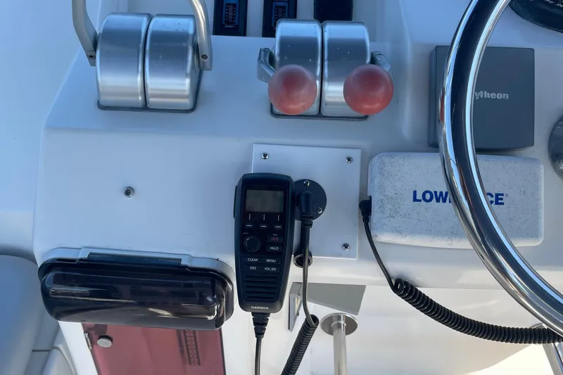  Yacht Photos Pics Control panel of a 1997 McKinna 48 Pilothouse with steering wheel and navigation equipment.