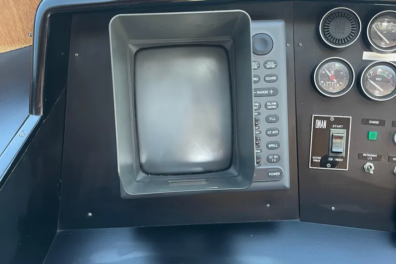  Yacht Photos Pics Control panel of a 1997 McKinna 48 Pilothouse with gauges and switches.