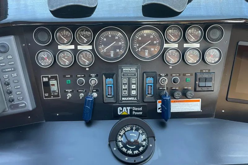  Yacht Photos Pics Control panel of a 1997 McKinna 48 Pilothouse with gauges and CAT Diesel Power.