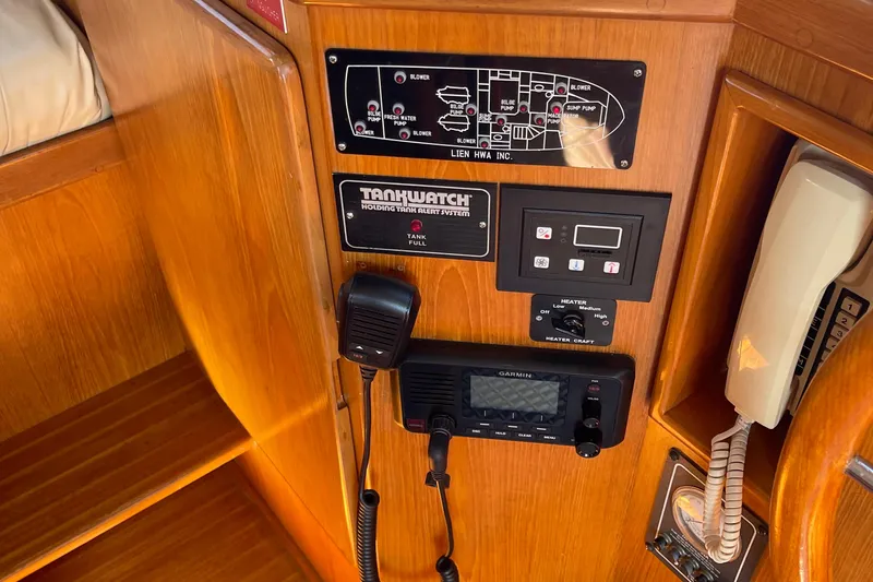  Yacht Photos Pics Control panel of a 1997 McKinna 48 Pilothouse with communication and monitoring systems.