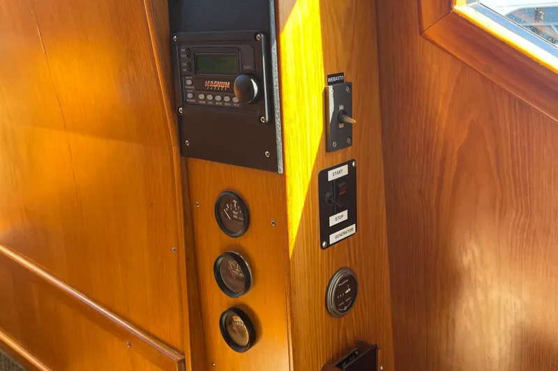  Yacht Photos Pics Control panel on 1997 McKinna 48 Pilothouse yacht with gauges and switches.