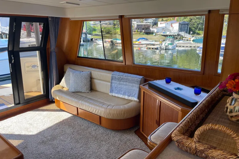  Yacht Photos Pics Luxurious interior of 1997 McKinna 48 Pilothouse yacht with waterfront view.
