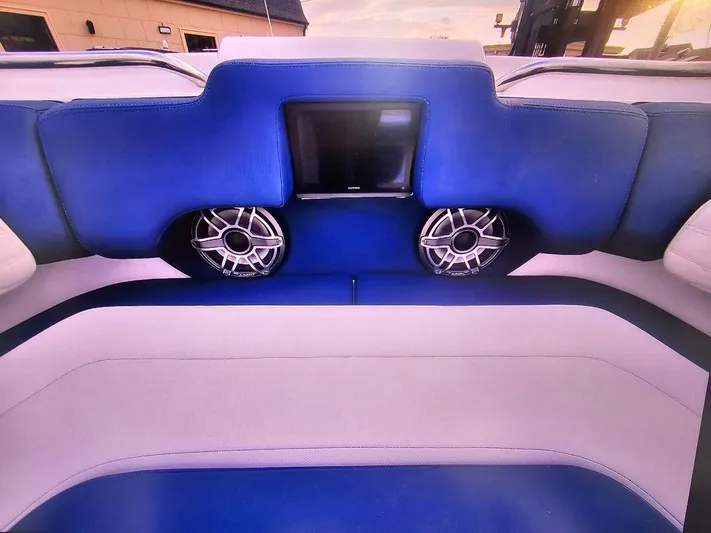  Yacht Photos Pics 2022 Cigarette 41 Nighthawk boat interior with blue seating and built-in speakers.