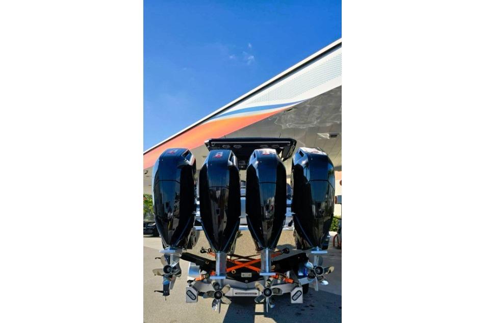 2025 Nor-Tech 400 Supersport with four powerful outboard engines, under a clear blue sky.