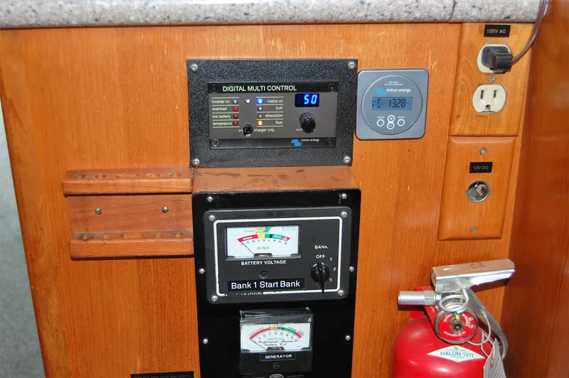 Legacy Yacht Photos Pics 1981 Ocean Alexander 50 Pilothouse control panel with fire extinguisher.
