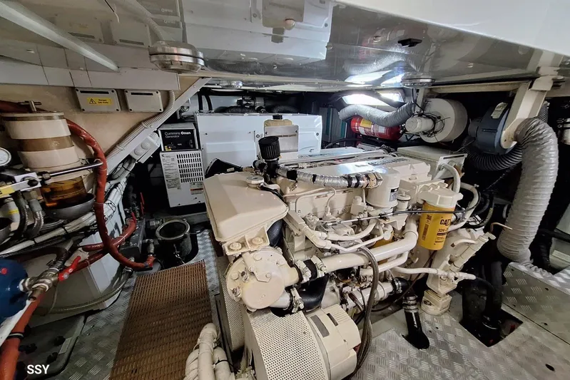 Cygnus Of Anglesey Yacht Photos Pics Engine room of a 2004 Oyster 82 yacht, featuring complex machinery and equipment.