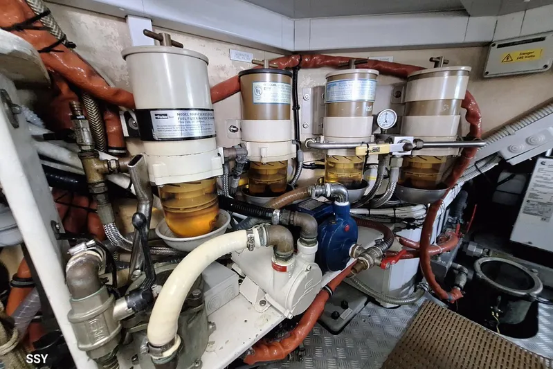 Cygnus Of Anglesey Yacht Photos Pics Engine room of a 2004 Oyster 82 yacht, showcasing fuel filtration system.