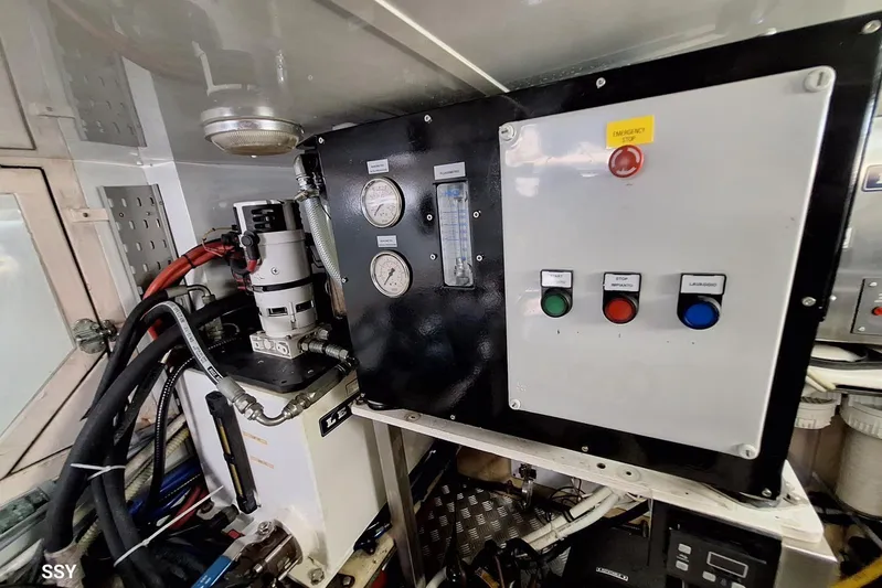 Cygnus Of Anglesey Yacht Photos Pics Engine room control panel of a 2004 Oyster 82 yacht with gauges and emergency stop button.