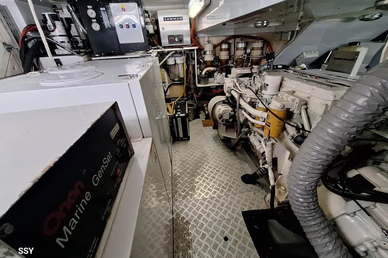 Cygnus Of Anglesey Yacht Photos Pics Engine room of a 2004 Oyster 82 yacht, featuring Onan Marine GenSet and mechanical components.