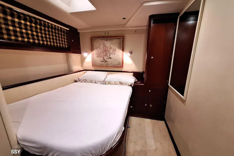 Cygnus Of Anglesey Yacht Photos Pics Luxurious bedroom interior of 2004 Oyster 825 yacht with elegant wood finishes.