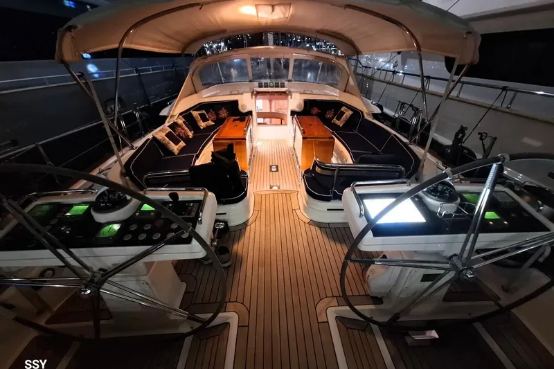 Cygnus Of Anglesey Yacht Photos Pics Luxurious 2004 Oyster 825 yacht interior with elegant seating and dual steering wheels.