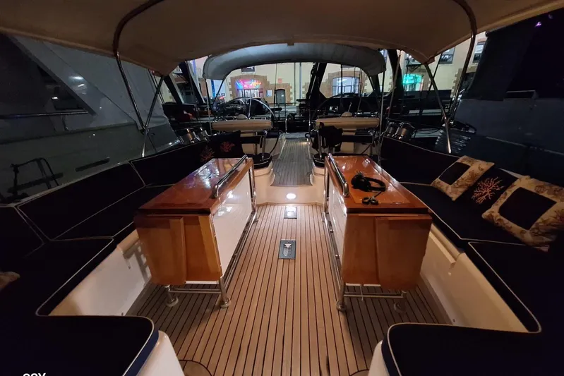 Cygnus Of Anglesey Yacht Photos Pics Luxurious 2004 Oyster 825 yacht interior with elegant seating and wooden accents.
