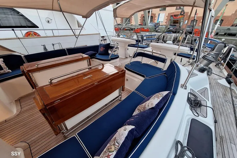 Cygnus Of Anglesey Yacht Photos Pics Luxurious 2004 Oyster 825 yacht interior with elegant seating and polished wood accents.