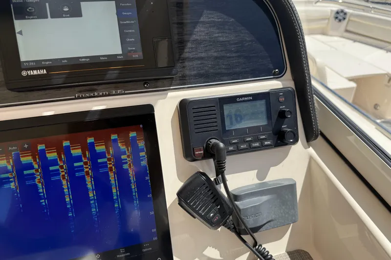 335-714 Used Yacht Photos Pics Control panel of 2021 Grady-White Freedom 335 boat with Garmin and Yamaha displays.