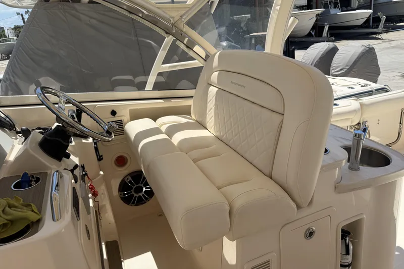 335-714 Used Yacht Photos Pics 2021 Grady-White Freedom 335 boat interior with luxurious seating and steering wheel.