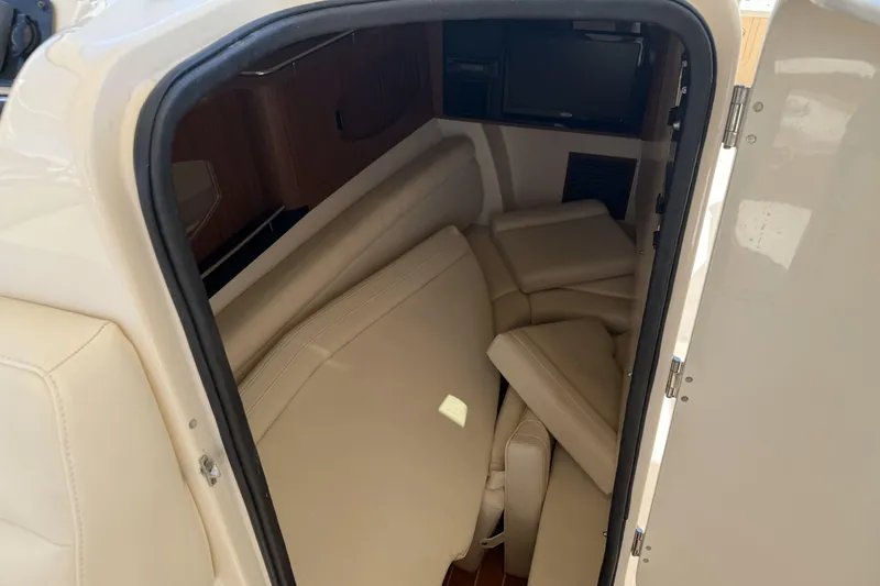 335-714 Used Yacht Photos Pics Interior cabin of 2021 Grady-White Freedom 335 boat with beige seating.