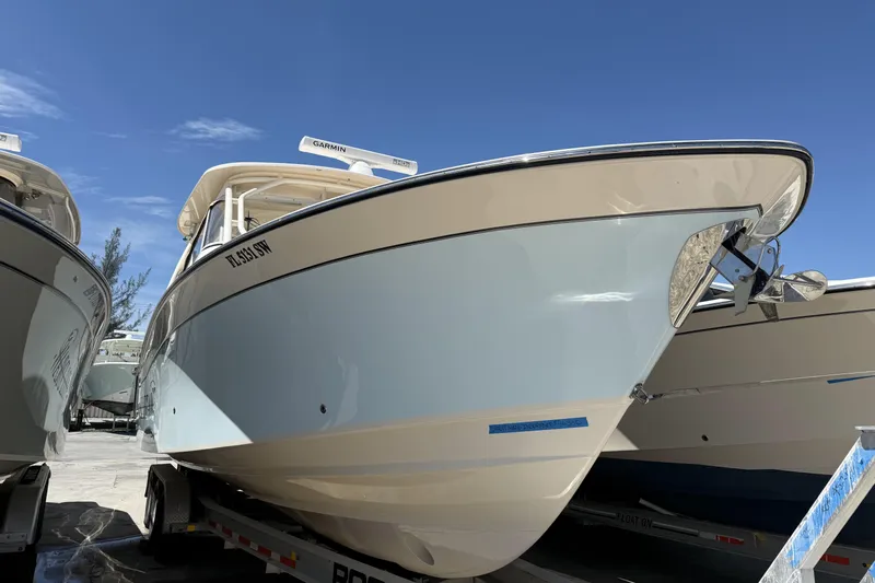 335-714 Used Yacht Photos Pics 2021 Grady-White Freedom 335 boat on trailer under clear blue sky.
