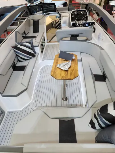 Custom Order Your 305 Today! Yacht Photos Pics Luxurious 2025 Hanover 305 Inboard boat interior with modern seating and sleek design.