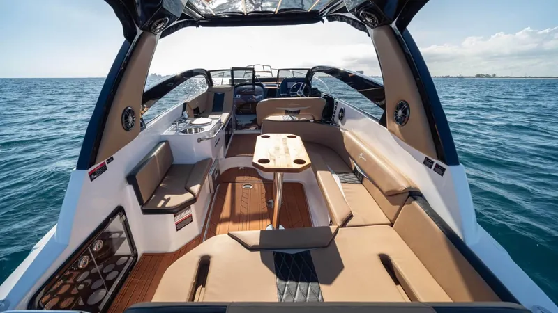 Custom Order Your 305 Today! Yacht Photos Pics Luxurious 2025 Hanover 305 Inboard boat interior with spacious seating and ocean view.