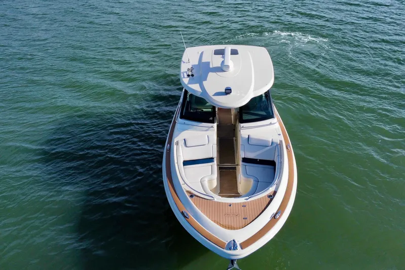  Yacht Photos Pics 2021 Chris-Craft Calypso 35 boat on calm water, aerial view.