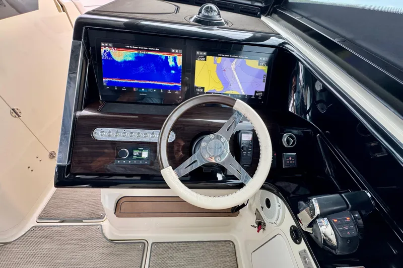  Yacht Photos Pics 2021 Chris-Craft Calypso 35 helm with dual navigation screens and leather-wrapped steering wheel.