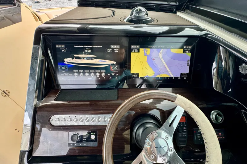  Yacht Photos Pics Dashboard of 2021 Chris-Craft Calypso 35 with navigation screens and steering wheel.