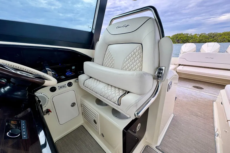  Yacht Photos Pics 2021 Chris-Craft Calypso 35 interior with luxurious seating and helm controls.