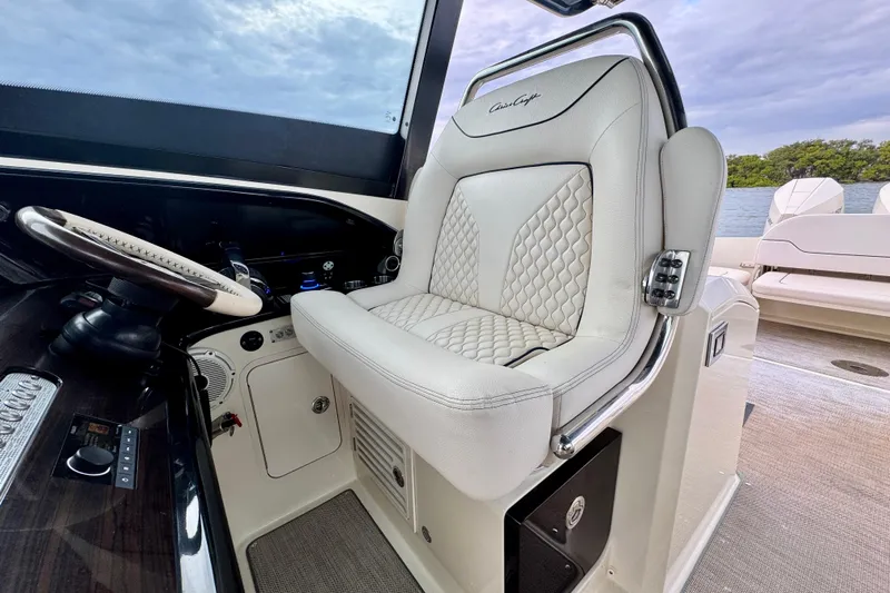  Yacht Photos Pics 2021 Chris-Craft Calypso 35 helm seat with luxurious white upholstery and sleek design.