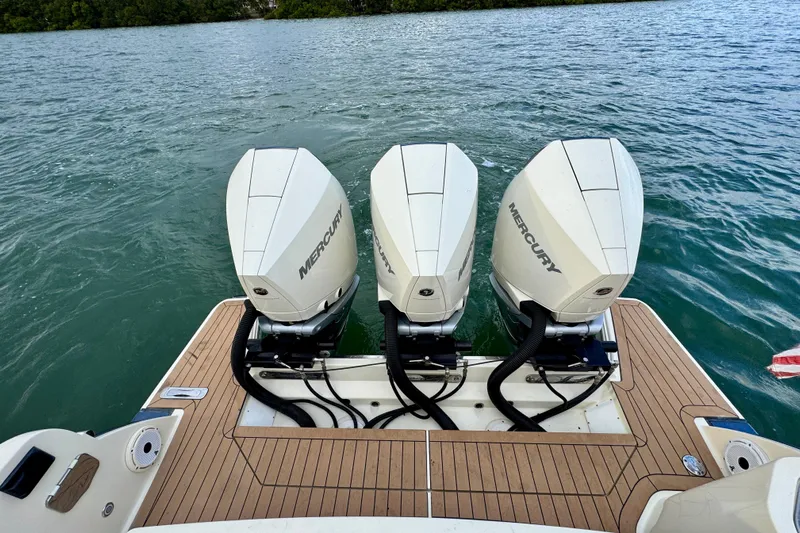  Yacht Photos Pics 2021 Chris-Craft Calypso 35 with triple Mercury outboard engines on teak deck.