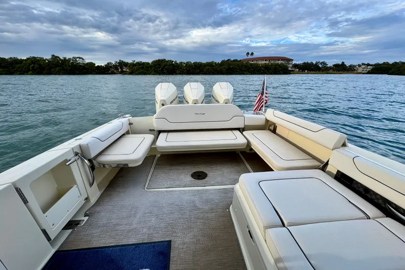  Yacht Photos Pics 2021 Chris-Craft Calypso 35 boat interior with seating, on calm water.