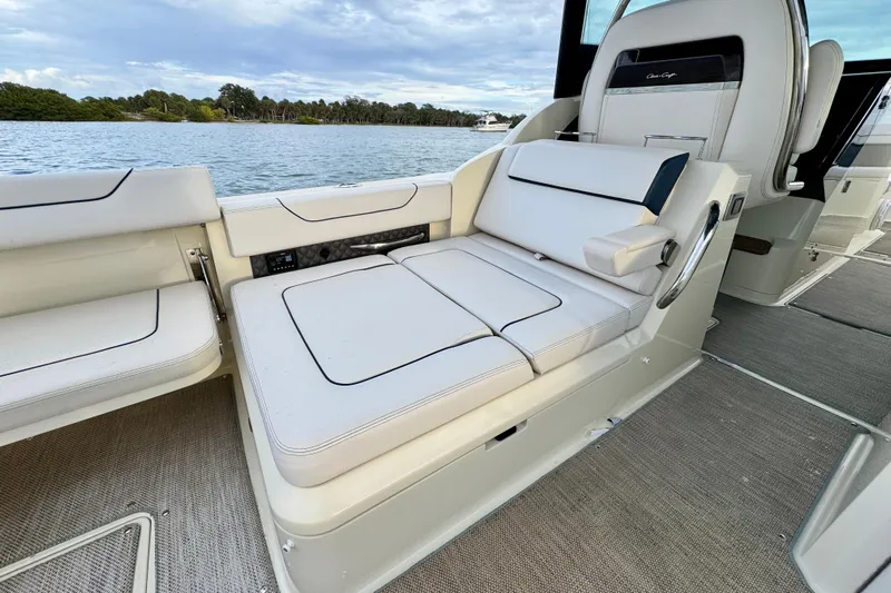  Yacht Photos Pics 2021 Chris-Craft Calypso 35 boat interior with luxurious seating and scenic water view.