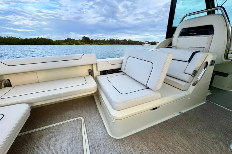  Yacht Photos Pics 2021 Chris-Craft Calypso 35 boat interior with luxurious seating and scenic water view.