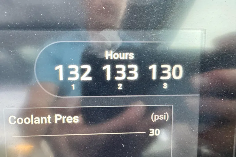  Yacht Photos Pics Display panel of 2021 Chris-Craft Calypso 35 showing engine hours and coolant pressure.