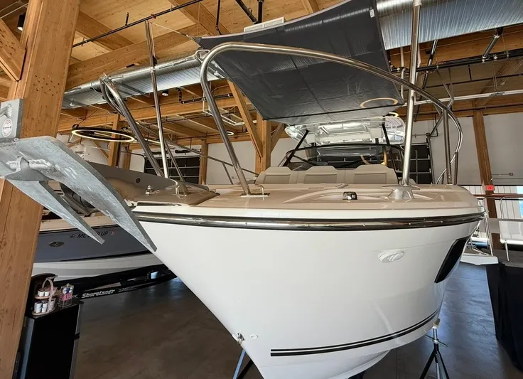  Yacht Photos Pics 2025 Jeanneau Leader 9.0 WA boat in a wooden dock, showcasing sleek design and modern features.