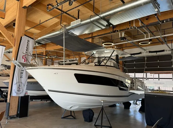  Yacht Photos Pics 2025 Jeanneau Leader 9.0 WA boat displayed indoors, showcasing sleek design and modern features.