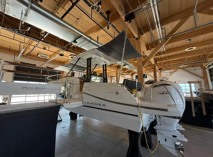 Yacht Photos Pics 2025 Jeanneau Leader 9.0 WA boat displayed indoors with Yamaha engine.