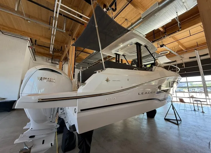 Yacht Photos Pics 2025 Jeanneau Leader 9.0 WA boat in a showroom with Yamaha engine.