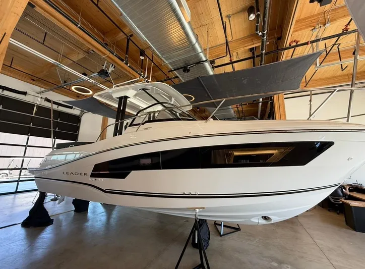  Yacht Photos Pics 2025 Jeanneau Leader 9.0 WA boat displayed indoors, showcasing sleek design and modern features.