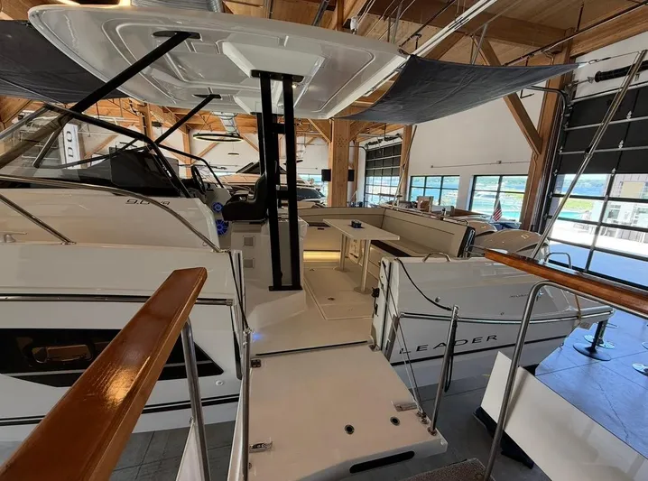  Yacht Photos Pics 2025 Jeanneau Leader 9.0 WA boat interior in a showroom setting.