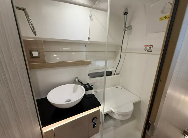  Yacht Photos Pics Modern bathroom in 2025 Jeanneau Leader 9.0 WA boat with sleek fixtures and compact design.