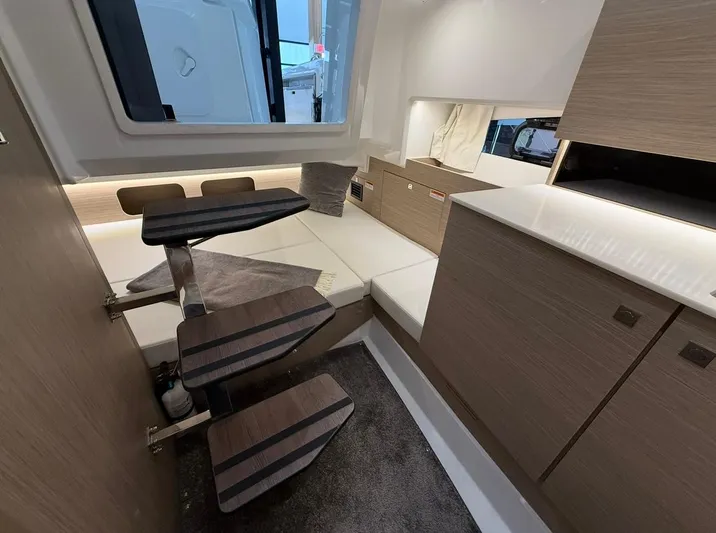  Yacht Photos Pics 2025 Jeanneau Leader 9.0 WA cabin interior with modern design and compact layout.