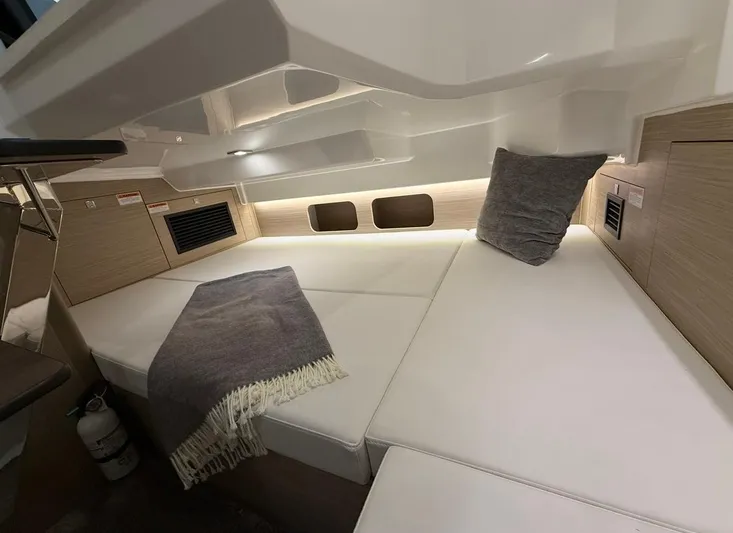  Yacht Photos Pics 2025 Jeanneau Leader 9.0 WA cabin interior with cozy bedding and modern design.